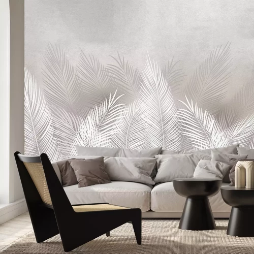 Fotobehang Een plantenmotief van palmbladeren op een betonnen textuur