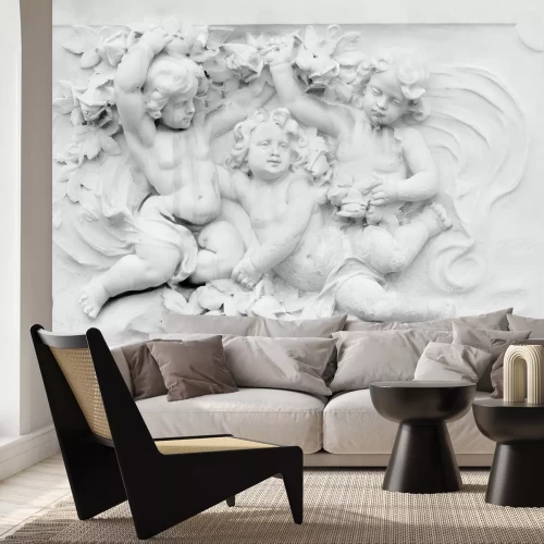 Fotobehang Witte engelsculpturen op een lichte, egale achtergrond