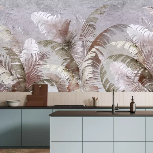 Fotobehang Exotische palm- en bananenbladeren op een grijze achtergrond.