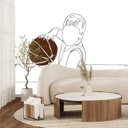 Fotobehang Een jonge jongen die basketbal oefent