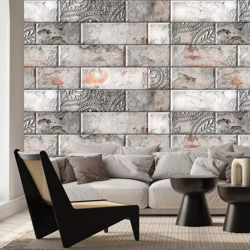 Fotobehang Bakstenen muur met een delicaat ornament