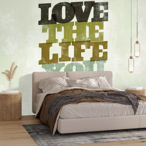 Fotobehang Een delicate inscriptie over de liefde voor het leven op beton