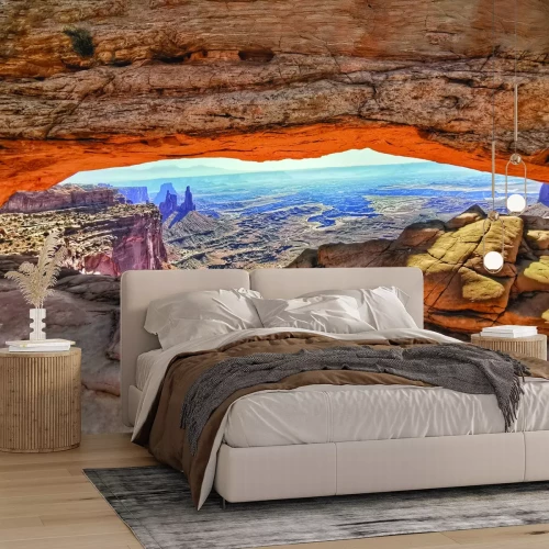 Fotobehang Uitzicht op rotsformaties en uitgestrekt woestijnlandschap