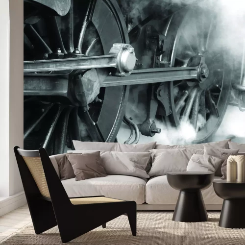 Fotobehang Een monochrome foto van de grote wielen van een locomotief.