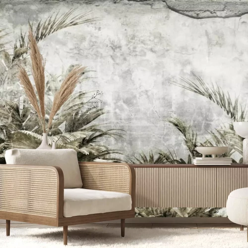 Fotobehang Tropische bladeren op een betonnen achtergrond