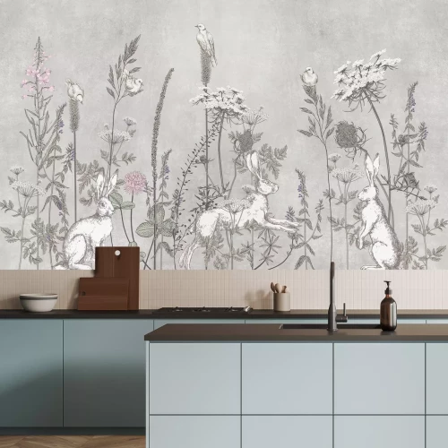 Fotobehang Een veldweide met hazen en wilde bloemen