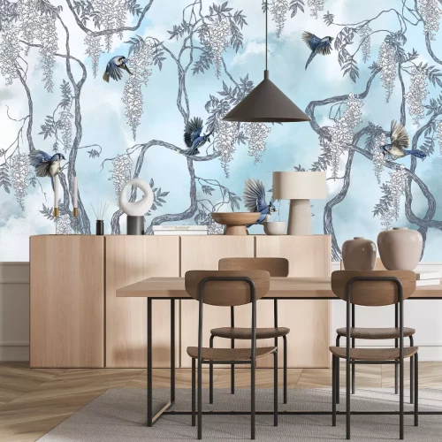 Fotobehang Een boom met bloemen en vogels tegen de lucht