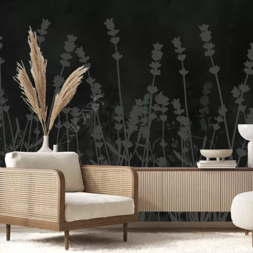 Fotobehang Grijze schaduwen van lavendelbloemen tegen de betonnen achtergrond