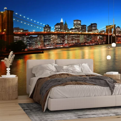 Fotobehang Brooklyn Bridge bij zonsondergang met de skyline van de stad