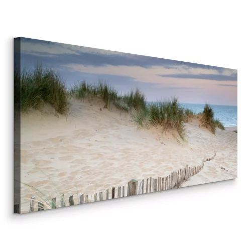 Canvas Een strand met zand en zeevegetatie