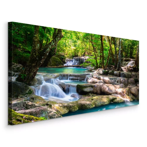 Canvas Een turquoise waterval in een groen bos