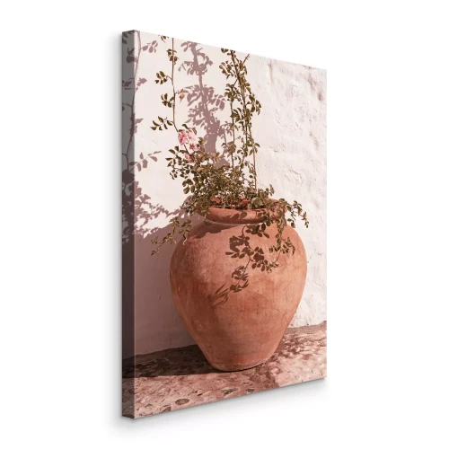 Canvas Een aarden pot met een tere plant