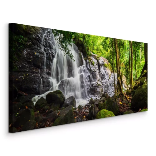 Canvas Een boswaterval die over rotsen stroomt