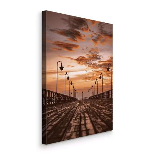 Canvas Een vredige houten steiger in het licht van de ondergaande zon