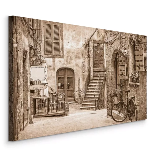 Canvas Een charmante geplaveide straat in een rustig stadje