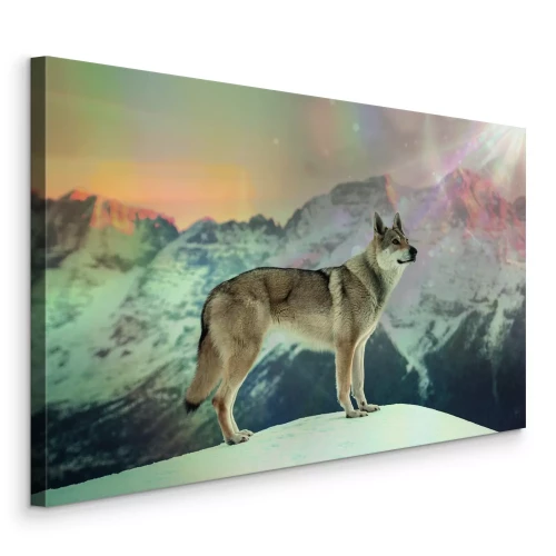 Canvas Een majestueuze wolf tegen een bergzonsondergang