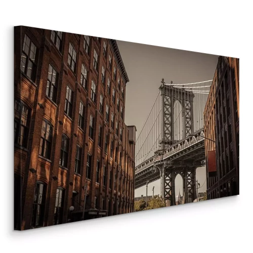 Canvas Een bakstenen gebouw met uitzicht op de brug