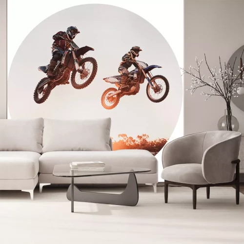 Sticker Motocrossrijders in de lucht tegen een achtergrond van de zonsondergang.