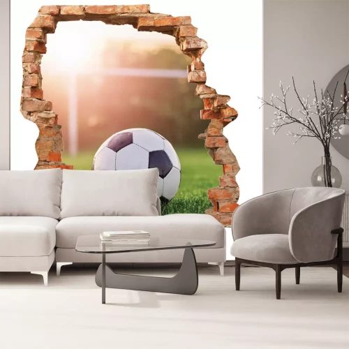 Sticker 3D-gat in de bakstenen muur met een voetbalmotief