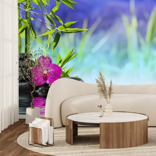 Fotobehang Paarse orchidee en bamboe op water