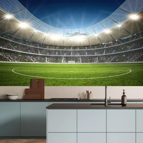 Fotobehang Een voetbalveld verlicht door schijnwerpers