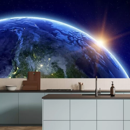 Fotobehang De opkomende zon boven de aarde