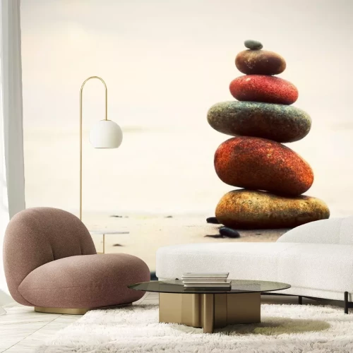 Sticker Stenen piramide op zand symboliseren zen, harmonie, evenwicht