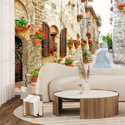 Fotobehang Een pittoreske bloemenstrook in het Italiaanse heuvelstadje