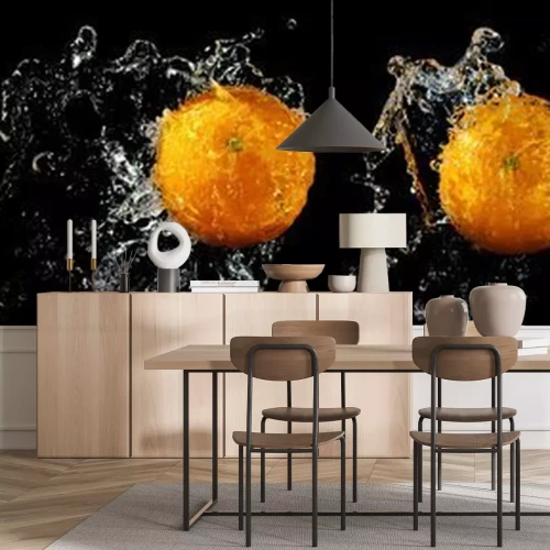 Fotobehang Verse sinaasappelen op een zwarte achtergrond