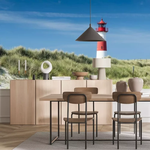 Fotobehang Een vuurtoren op een zandduin