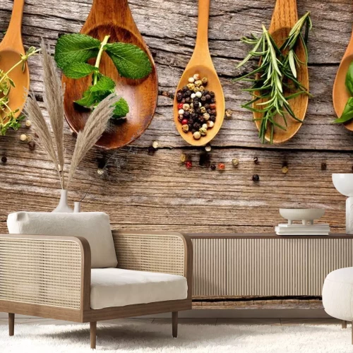 Fotobehang Diverse specerijen en kruiden gerangschikt op houten lepels.