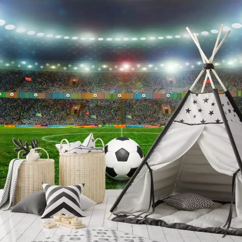 Sticker Een bal op de grasmat van een groot verlicht stadion