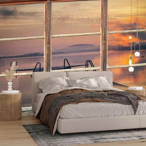 Fotobehang Een raam met uitzicht op de zonsopgang