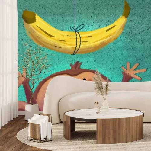 Sticker Een banaan aan een touwtje en een aap