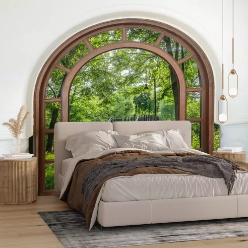 Fotobehang Uitzicht door de boogdeur op de brug en het groen