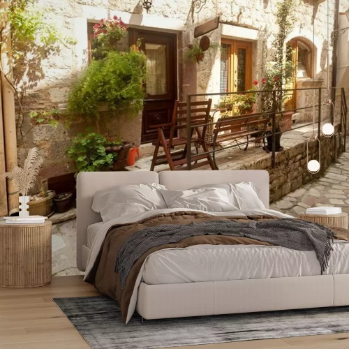 Fotobehang Street of old town decorated with pots and flowers