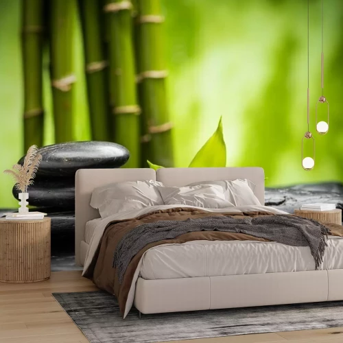 Fotobehang Zwarte platte stenen en bamboe