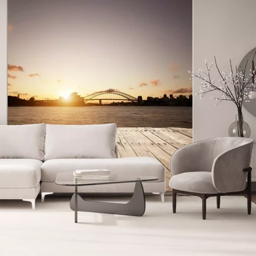 Fotobehang De waterkant van Sydney met de brug en het operagebouw tegen de ondergaande zon