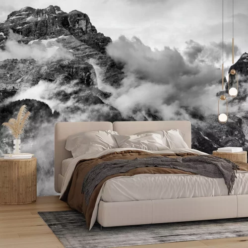 Sticker Tot aan de grenzen van rotsachtige toppen in de wolken