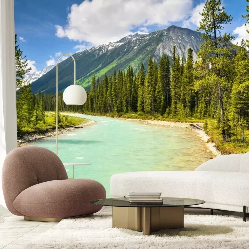 Fotobehang Blauwe rivier op de achtergrond van de bergen