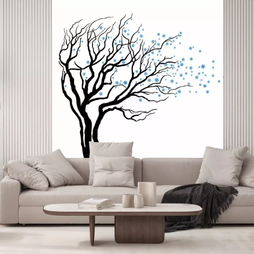 Sticker Boom met bladeren vol sneeuwvlokken in de wind