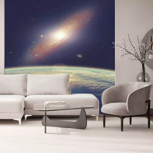 Fotobehang Het Andromedastelsel boven de aarde