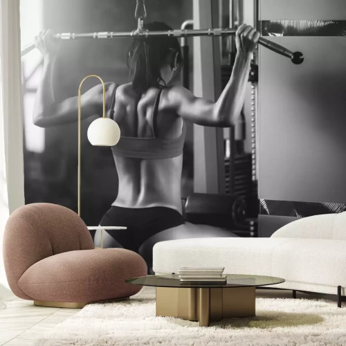 Fotobehang Vrouw die op fitnessapparaat traint