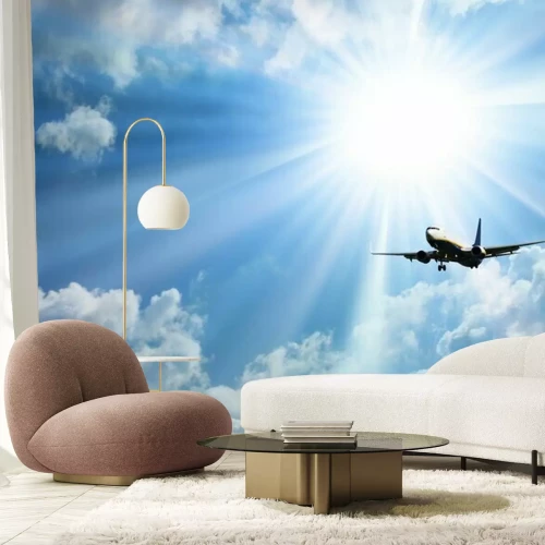 Fotobehang Een vliegtuig dat opstijgt naar de zon