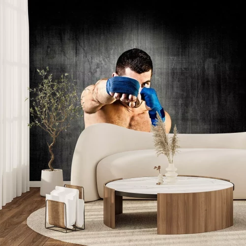 Fotobehang Bokser op de achtergrond van een betonnen muur