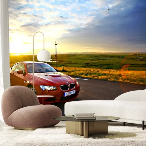 Fotobehang Bucharest, Romania - July 3, 2013: A BMW M3 car drives through a beautiful scenery, at sunset. The BMW M3 is a high-performance version of the BMW 3-Series, developed by BMW's motorsport division, BMW