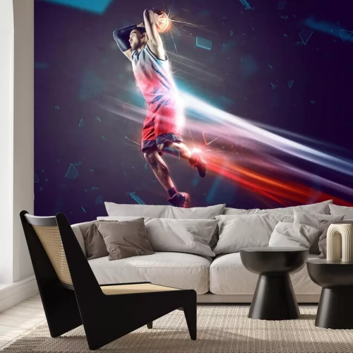 Fotobehang Een basketballer gooit de bal