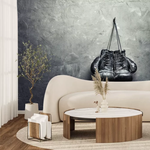 Fotobehang Bokshandschoenen op een betonnen muur