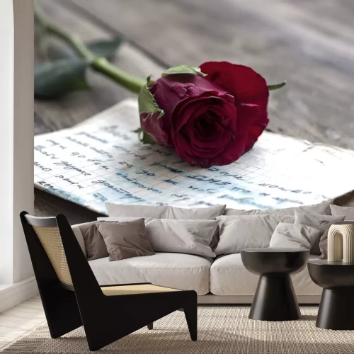 Sticker Een roos liggend op een blad