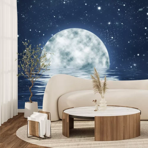 Fotobehang Maan die ondergaat achter de horizon bij een sterrenhemel